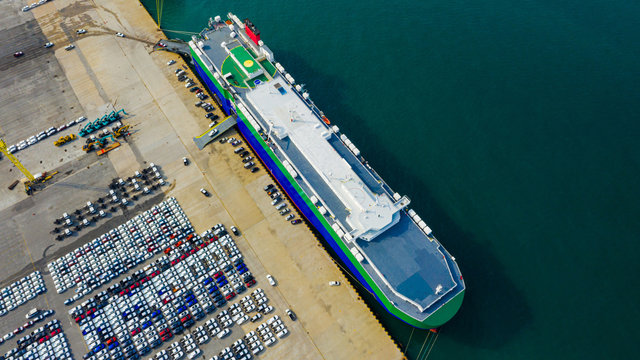 Aerial view ro-ro ship, Cargo ship transportation of business logistic sea freight, New Cars produced by year up in the port for Cargo ship and Cargo import-export around in the world