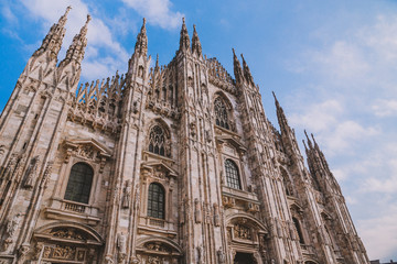Fototapeta premium Piazza Del Duomo, Milano, Italy - a view from Milano Cathedral over beautiful sunset and place full of tourists