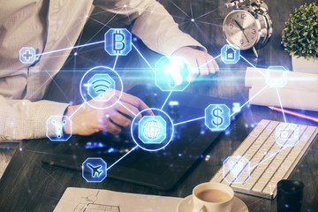 Double exposure of man's hands holding and using a phone and social network theme drawing.