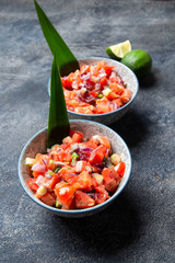 Hawaiian food Salmon Lomi Lomi. Salmon with tomatoes, onion and lemon