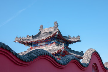 China, Heihe, July 2019: the Fragment of the roof. Taoist temple outside the city in Heihe in the summer.