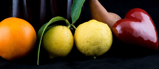 Orange, Lemon and Pear on black background