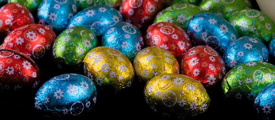 Beautiful colorful tiny Easter Eggs on black background