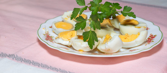 Dish of hard boiled eggs on the table