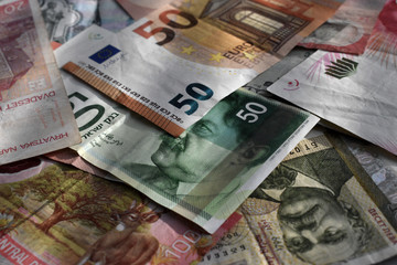 various currencies from countries spanning the World .