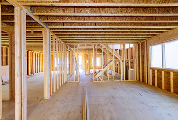 Building construction, wood framing new home under construction roof being built