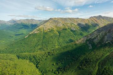 Obraz premium aerial view of Kamchatka volcanos, green valleys, snow and ice and the wonderful view of pure nature.