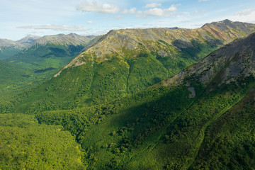 aerial view of Kamchatka volcanos, green valleys, snow and ice and the wonderful view of pure nature.
