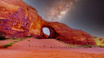 Starry Sky behind the Ear of The Wind, a hole in a rock formation in Monument Valley Navajo Tribal Park on the border of Utah and Arizona, United States © hpbfotos