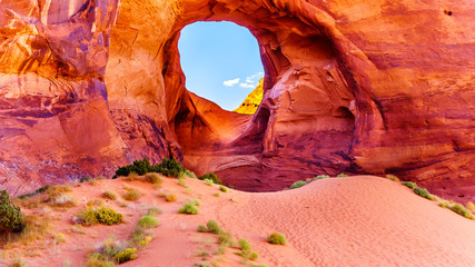 The Ear of The Wind, a hole in a rock formation in Monument Valley Navajo Tribal Park on the border of Utah and Arizona, United States