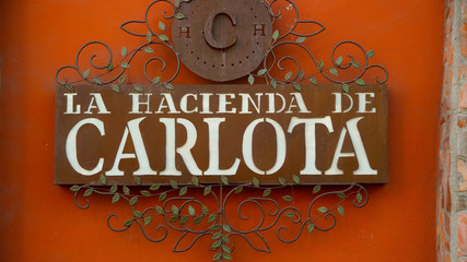 Beautiful Bright Orange Spanish Sign in Puerto Vallarta Mexico