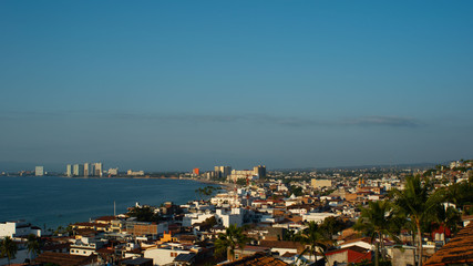 Naklejka na ściany i meble Large Coastal City View of the Ocean and Buildings in Puerto Vallarta Mexico