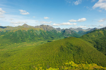 Plakat aerial view of Kamchatka volcanos, green valleys, snow and ice and the wonderful view of pure nature.
