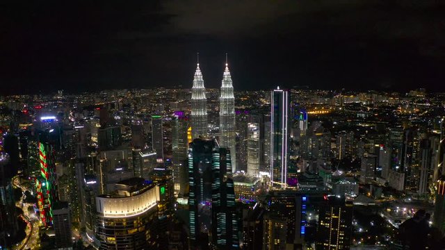 4k stock: Top view, aerial view of skyscrapers, KLCC at the Kuala Lumpur city in the night. The best stock of aerial view of Petronas Twin Towers or KLCC Kuala Lumpur city center in Malaysia at night