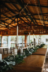  Decorated tables with candles and floral arrangements for celebration