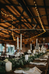  Decorated tables with candles and floral arrangements for celebration