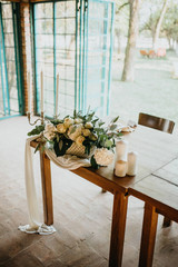  Decorated tables with candles and floral arrangements for celebrationv