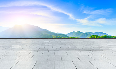 Empty square floor and green tea mountain nature landscape at sunset,panoramic view.