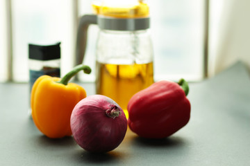 Peppes and oil can on the table