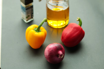 Peppes and oil can on the table