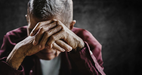 senior man covering his face with his hands. Depression and anxiety Copy space.