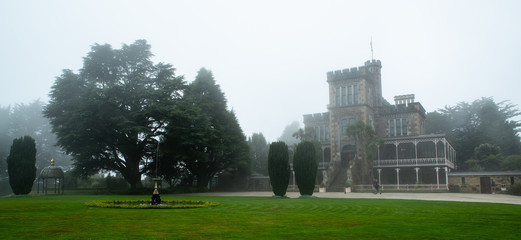 Fototapeta na wymiar Larnach Castle surrounded by fog in Dunedin New Zealand