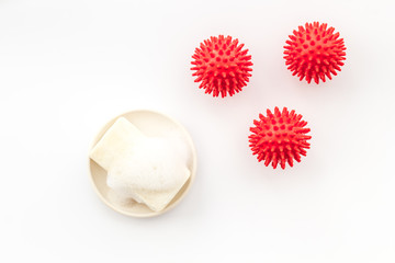 Coronavirus and soap on white background top-down