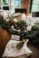  Decorated tables with candles and floral arrangements for celebrationv