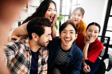 Selfie of group young man and woman team smiling having fun together