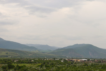 Fototapeta na wymiar View on the Kura river and Caucasus mountains from Ancient cave city Uplistsikhe, Georgia