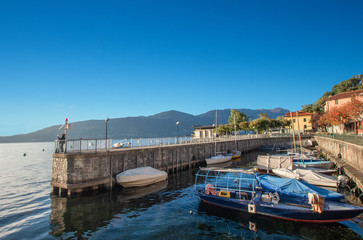 Fototapeta premium Castelveccana,characteristic little port of lake maggiore in a light summer day. Italy
