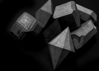 Isolated geometric wood shapes. Black and white.