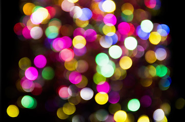 Multicolor colorful blurred festive bokeh circles. Christmas bright holiday background.