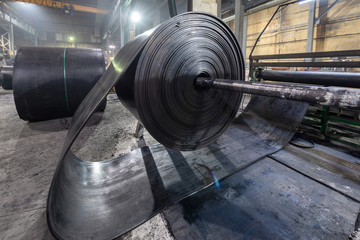 Interior of a factory for manufacturing rubber conveyor belts.