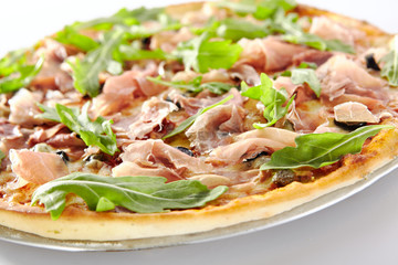 Pizza with Dried Tomatoes, Capers, Prosciutto, Arugula and Mozzarella