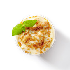 Dessert with Mango, Vanilla Cream and Cookie Crumbs Isolated