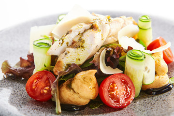 Salad with cheese profiteroles and sous vide chicken