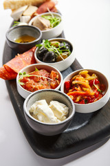 Wooden tray with snacks close up view