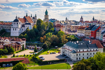 Lublin, Poland - Panoramic view of city center with St. Stanislav Basilica and Trinitarian Tower in historic old town quarter - obrazy, fototapety, plakaty