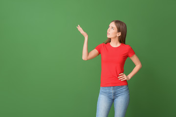 Thoughtful young woman on color background. Concept of choice