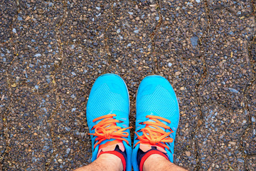 Blue exercise sneakers Prepare to stand ready to exercise in the park.