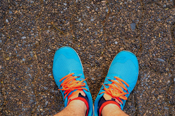 Blue exercise sneakers Prepare to stand ready to exercise in the park.
