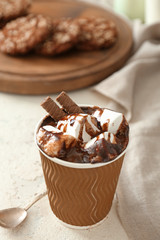 Cup of hot chocolate on table