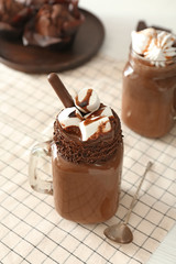 Mason jar of hot chocolate on table