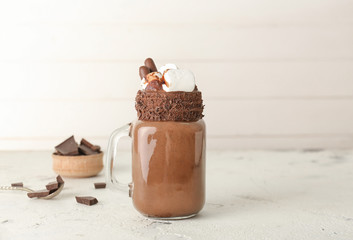 Mason jar of hot chocolate on table