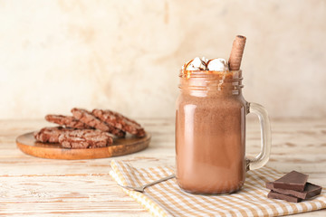 Mason jar of hot chocolate on table