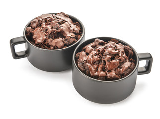 Chocolate mug cakes on white background