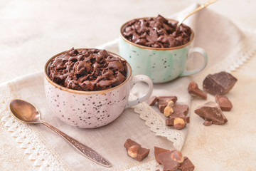 Chocolate mug cakes on table