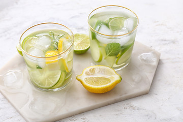 Glasses of fresh lime lemonade on table