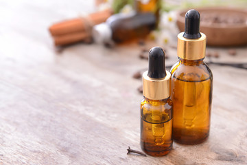Bottles with essential oils on table